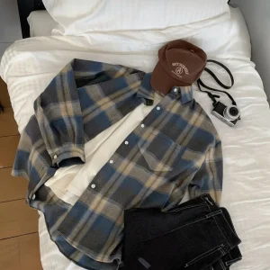 Oversized Brushed Flannel Shirt — A soft brushed flannel in oversized plaid, with button cuffs and a chest pocket. Chest