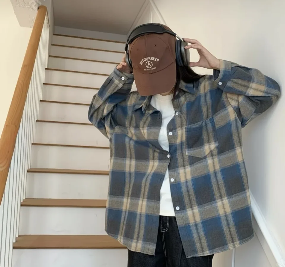 Oversized Brushed Flannel Shirt — A soft brushed flannel in oversized plaid, with button cuffs and a chest pocket. Chest