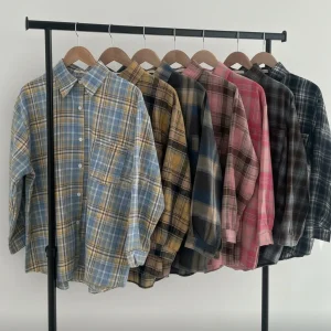 Oversized Brushed Flannel Shirt — A soft brushed flannel in oversized plaid, with button cuffs and a chest pocket. Chest