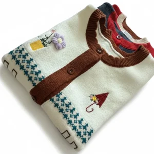 Embroidered Fair Isle Knit Vest — A button-front Fair Isle knit vest with embroidered houses, wreaths and flowers, in of