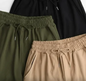 Wide-Leg Cargo Trousers — Soft wide-leg cargos with flap pockets and a drawstring elastic waist. Three sizes covering a 