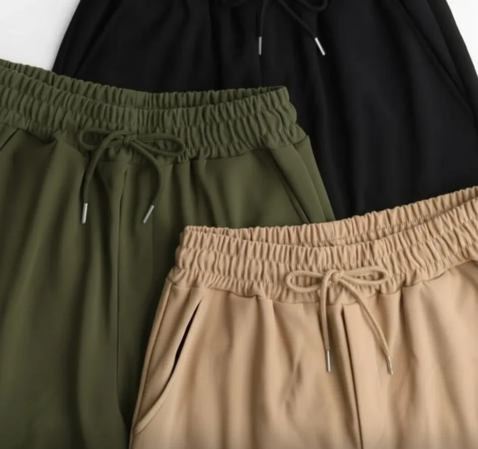 Wide-Leg Cargo Trousers — Soft wide-leg cargos with flap pockets and a drawstring elastic waist. Three sizes covering a