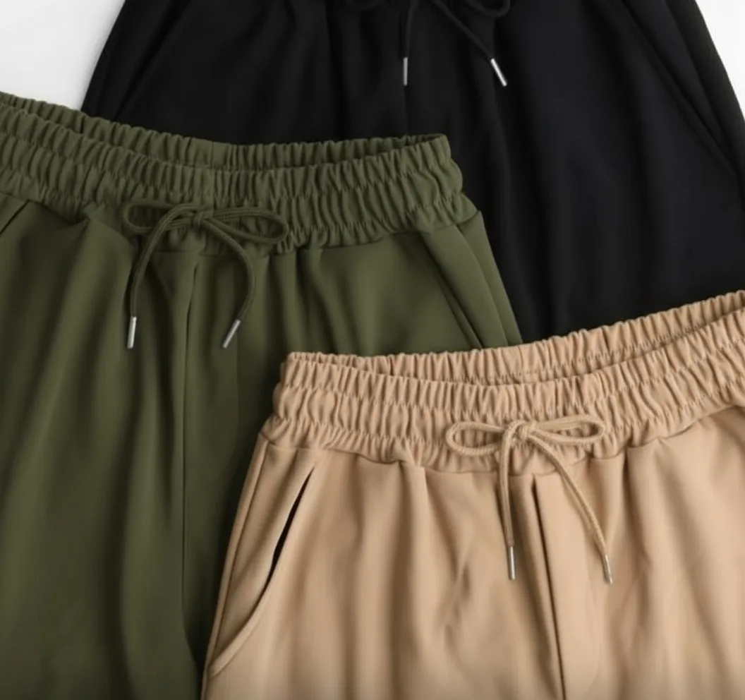 Wide-Leg Cargo Trousers Wide-Leg Cargo Trousers — Soft wide-leg cargos with flap pockets and a drawstring elastic waist. Three sizes covering a