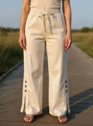 Wide-Leg Knit Trousers with Button Slits — Soft knit wide-leg trousers with side slits and three contrast buttons at the