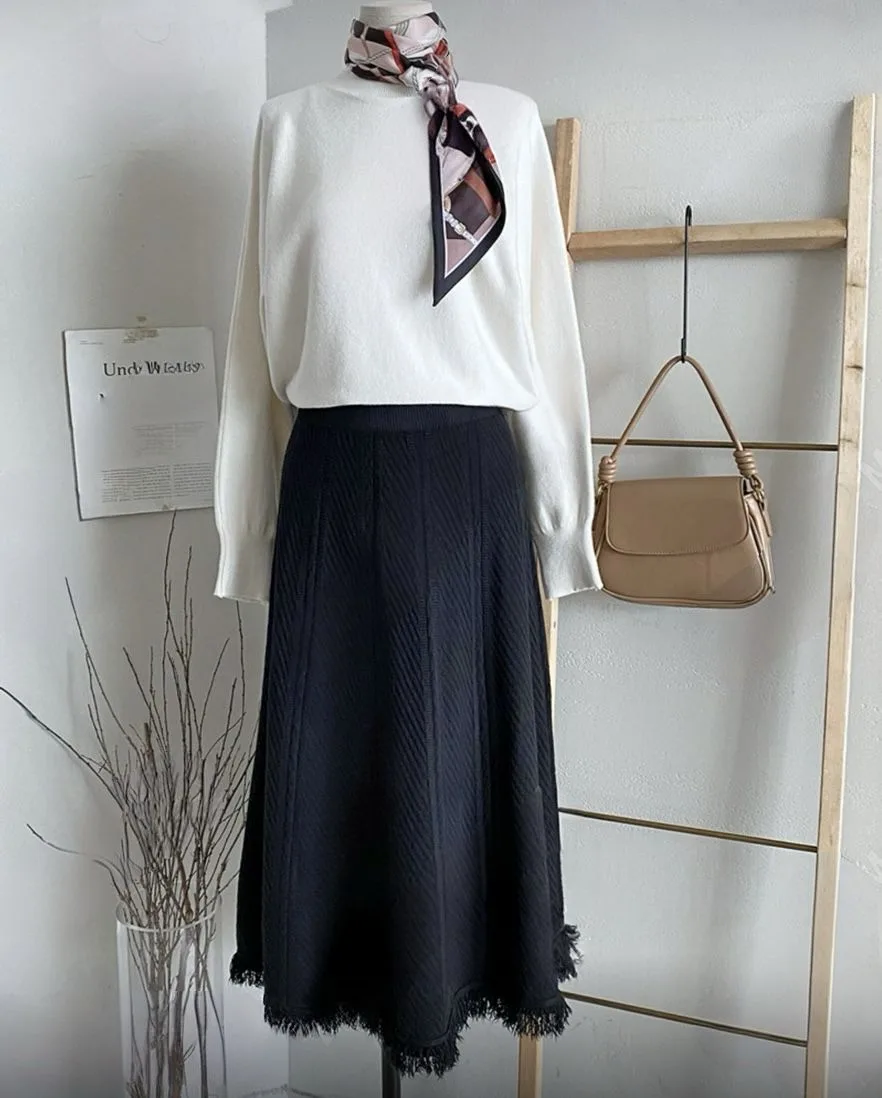 Ribbed Knit Maxi Skirt Ribbed Knit Maxi Skirt — A soft ribbed knit maxi with a wide elastic waist. Waist 26–36 inches, length 31 inches. Cream