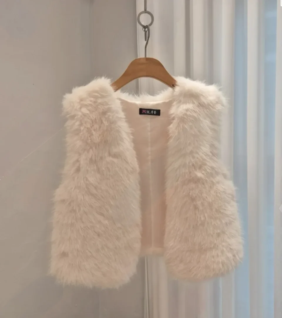Plush Faux Fur Vest — A cropped sleeveless faux fur vest, open-fronted, in espresso brown, smoke grey, creamy white or b