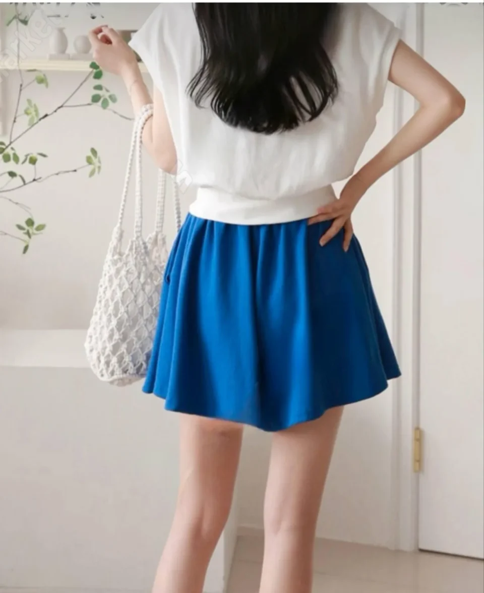 Flared Skater Skirt — A short flared skirt with a smooth elastic waist, in black, red or cobalt blue. Double knit with r