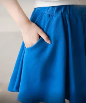 Flared Skater Skirt — A short flared skirt with a smooth elastic waist, in black, red or cobalt blue. Double knit with r