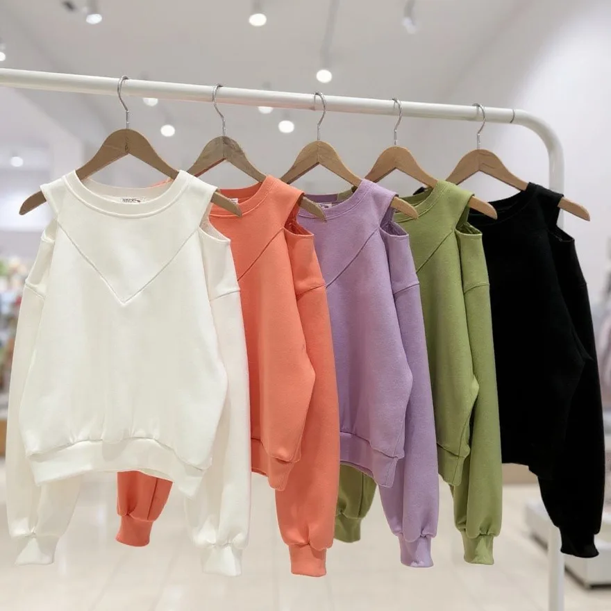 Cold-Shoulder Sweatshirt Cold-Shoulder Sweatshirt — A soft crew-neck sweatshirt with cut-out shoulders and a V-detail at the neck. Chest 27–42 in