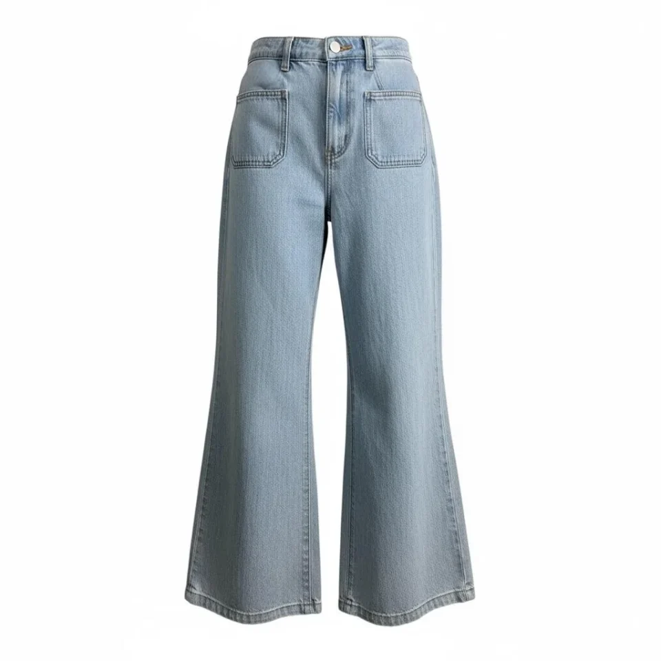 Light Wash Wide-Leg Flare Jeans — Faded light blue wide-leg jeans with a high rise and a flare from the knee. Rise 13 in