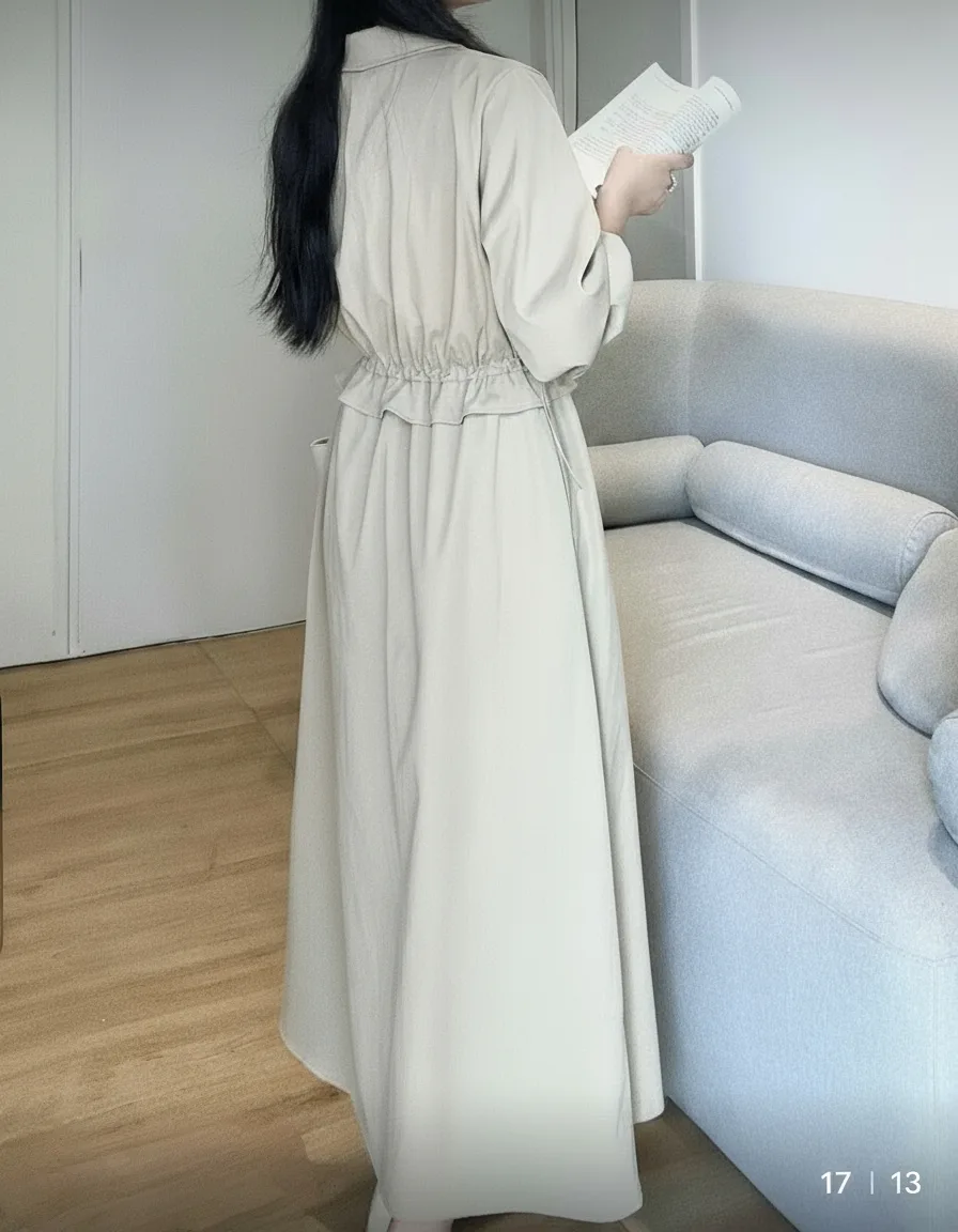 Long-Sleeved Maxi Shirtdress Long-Sleeved Maxi Shirtdress — A full-length shirtdress in a light woven cotton blend, with a drawstring waist, chest po