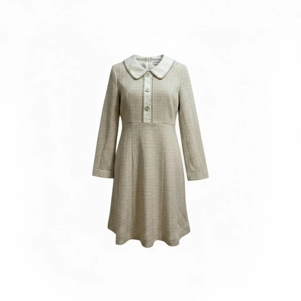 Parisian Tweed Mini Dress — A cream and beige tweed mini with a white Peter Pan collar, oversized contrast buttons and a