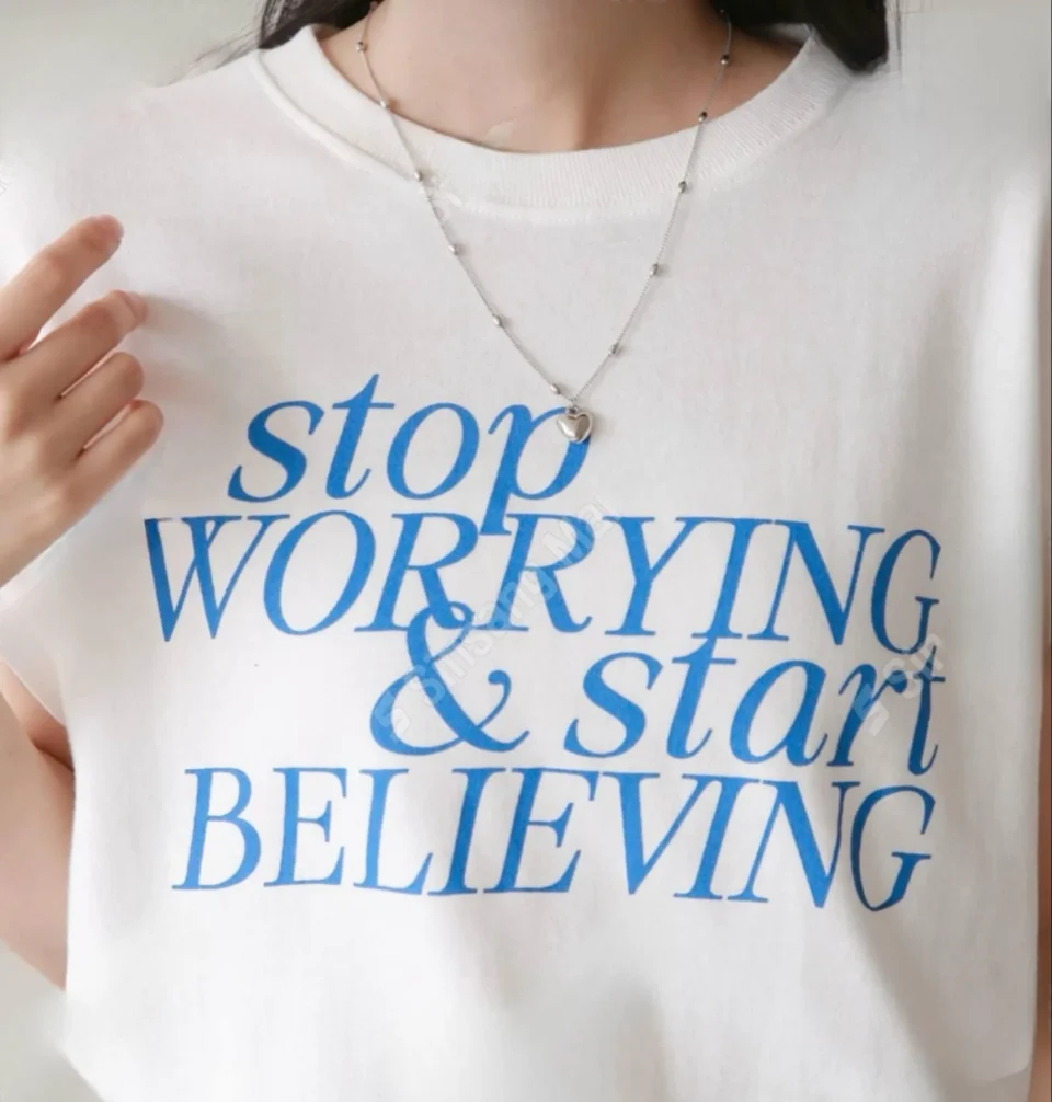 Stop Worrying Slogan Sweatshirt — A cropped cotton sweatshirt with the print set large across the chest. Boxy, with a dr