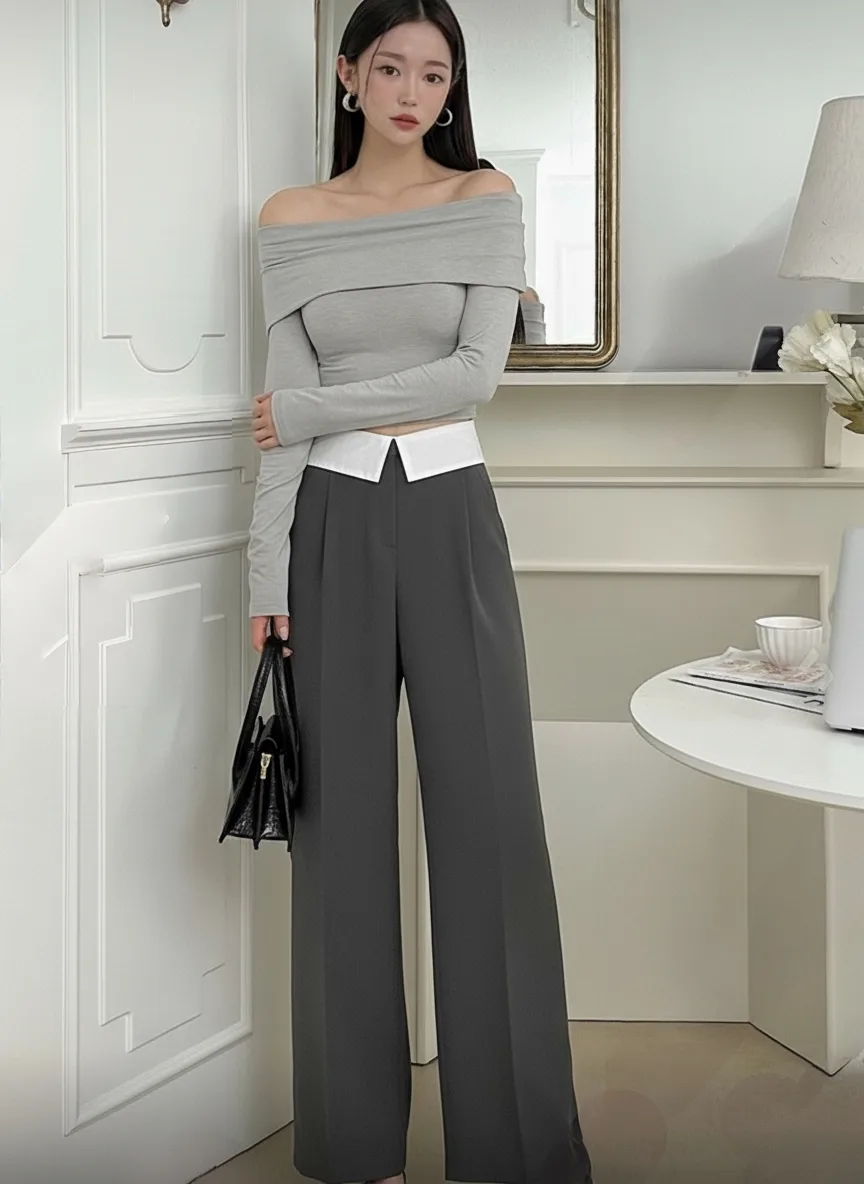 Contrast Waistband Wide-Leg Trousers — Charcoal wide-leg trousers with a white waistband showing above the dark fabric.