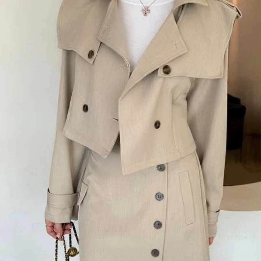 Cropped Trench and Skirt Set — A cropped double-breasted trench jacket with a matching asymmetric mini skirt. Black or b