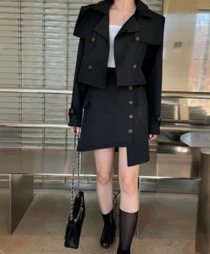 Cropped Trench and Skirt Set — A cropped double-breasted trench jacket with a matching asymmetric mini skirt. Black or b