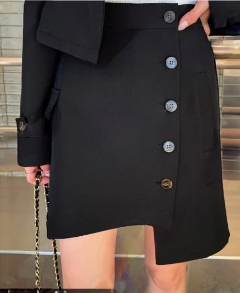 Cropped Trench and Skirt Set Cropped Trench and Skirt Set — A cropped double-breasted trench jacket with a matching asymmetric mini skirt. Black or b