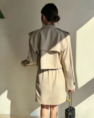 Cropped Trench and Skirt Set — A cropped double-breasted trench jacket with a matching asymmetric mini skirt. Black or b
