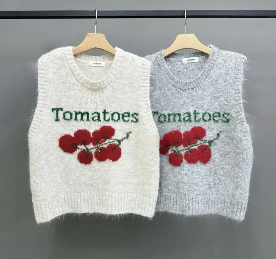 "Tomatoes" Embroidered Knit Vest — A sleeveless knit vest embroidered with cherry tomatoes on the vine and the word Toma