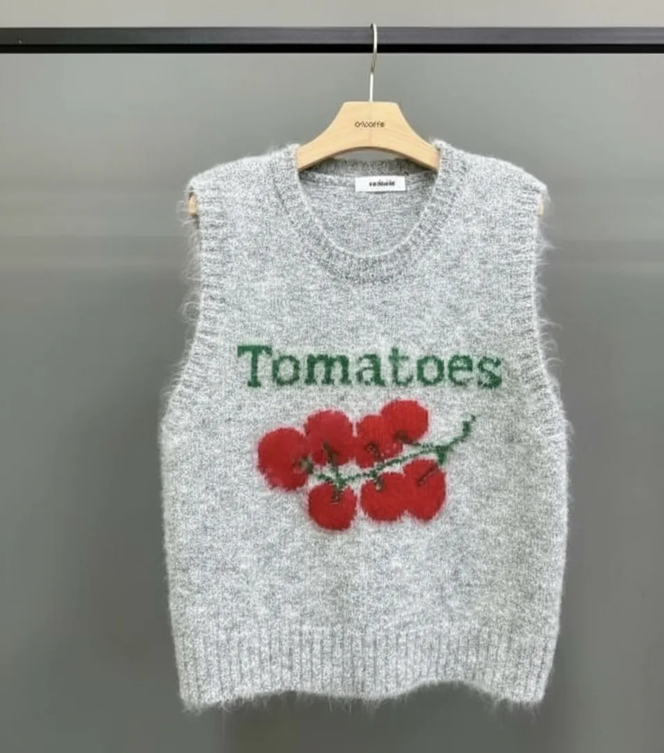 "Tomatoes" Embroidered Knit Vest "Tomatoes" Embroidered Knit Vest — A sleeveless knit vest embroidered with cherry tomatoes on the vine and the word Toma