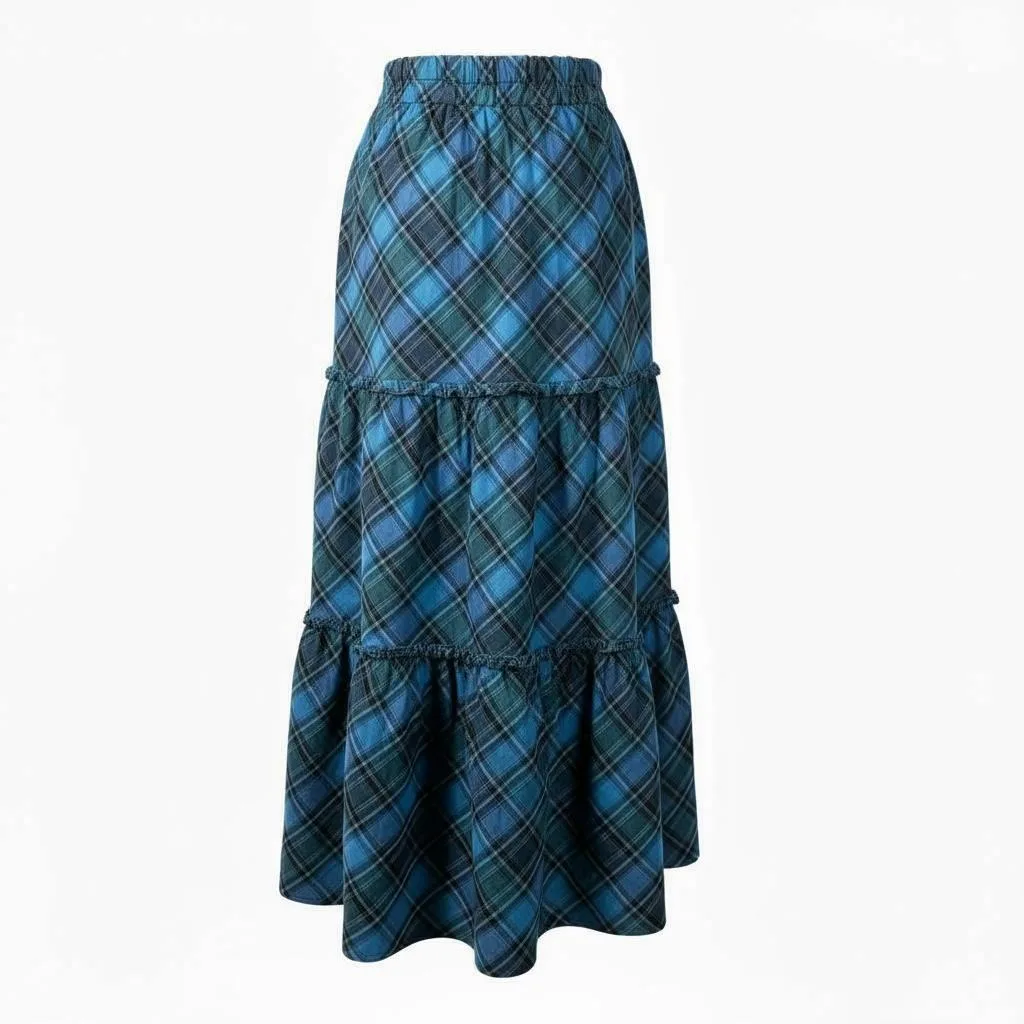 Highland Plaid Tiered Maxi Skirt Highland Plaid Tiered Maxi Skirt — A cerulean, teal and forest plaid maxi in two gathered tiers. Waist 26–30 inches, len