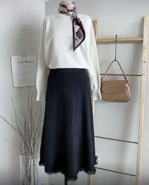 Knitted Fringe Midi Skirt — A soft knit A-line midi with a fringed hem, in creamy beige, grey or black. One size, elasti
