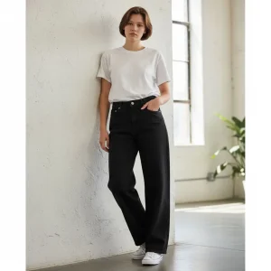 Midnight Wide-Leg Jeans — Deep indigo wide-leg jeans cut high at the waist and falling straight and full to the hem. Cut