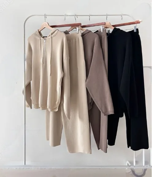 Rib-Knit Hooded Lounge Set Rib-Knit Hooded Lounge Set — A half-zip hooded rib-knit top with matching wide-leg trousers. Mocha, black or beige. One