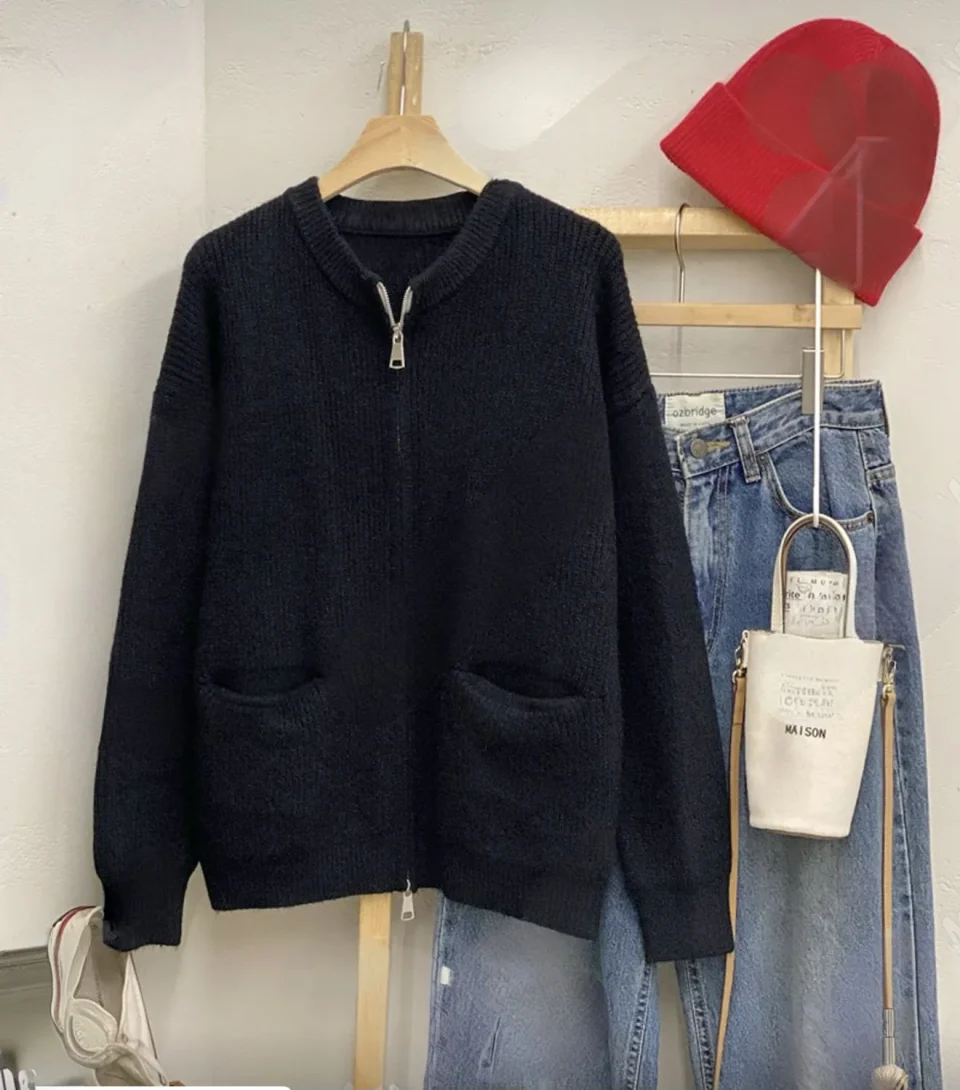 Ribbed Full-Zip Knit Cardigan — A ribbed knit cardigan with a full zip, a stand collar and two patch pockets. Black or o