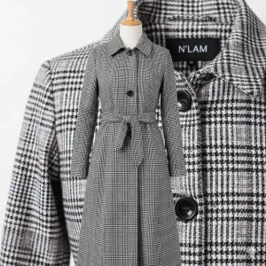 Glen Plaid Trench Coat — A black, white and pink glen plaid trench. Chest 40 inches, length 41 inches, sized L.