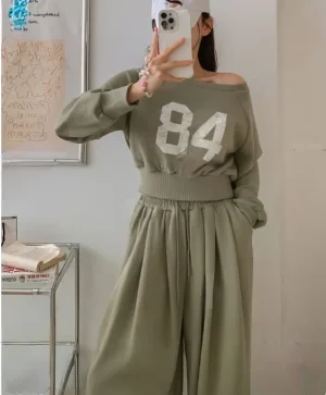"84" Cropped Sweat Set — A cropped 84 graphic sweatshirt with matching high-waisted wide-leg joggers. Four colours, one 