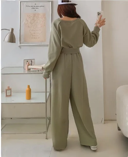 "84" Cropped Sweat Set "84" Cropped Sweat Set — A cropped 84 graphic sweatshirt with matching high-waisted wide-leg joggers. Four colours, one