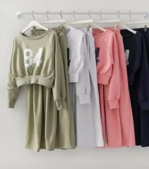 "84" Cropped Sweat Set — A cropped 84 graphic sweatshirt with matching high-waisted wide-leg joggers. Four colours, one 