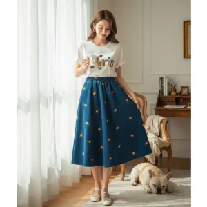 Embroidered Corduroy A-Line Skirt — A fine corduroy A-line scattered with small embroidered flowers, in sky blue or warm
