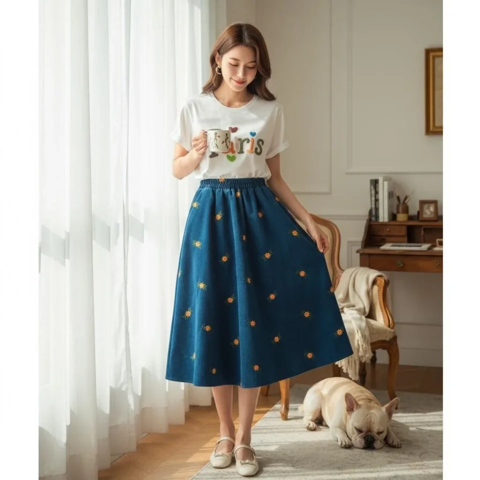 Embroidered Corduroy A-Line Skirt — A fine corduroy A-line scattered with small embroidered flowers, in sky blue or warm
