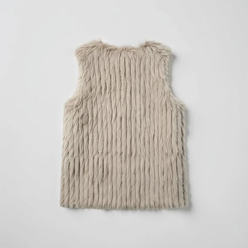 Whisper Soft Faux Fur Vest Whisper Soft Faux Fur Vest — A short faux fur vest with a fine, soft pile and an open front. Cut to a US medium. Cruelty